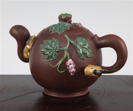 A Chinese Yixing enamelled pottery teapot, 20th century, 12cm.